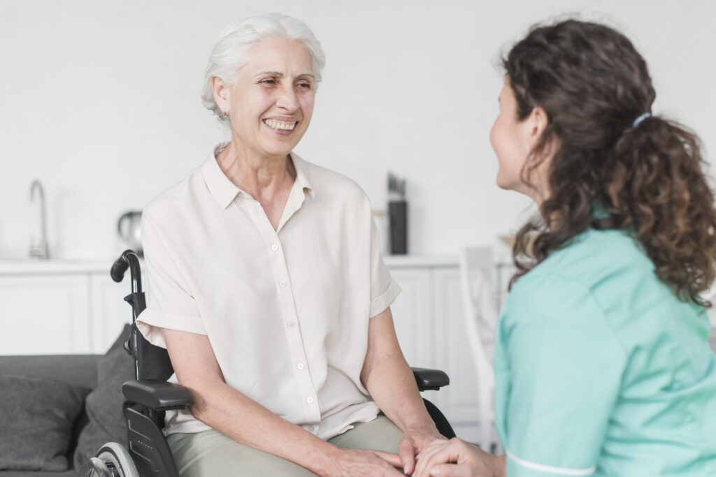 nurse looking female senior patient wheel chair
